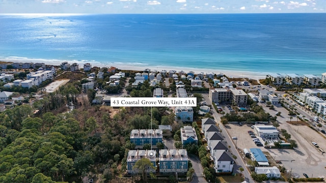 aerial view featuring a water view and a beach view