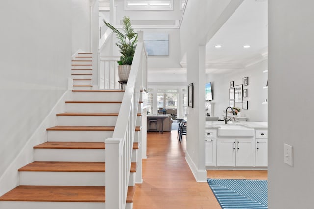 entrance foyer featuring sink and light wood-type flooring