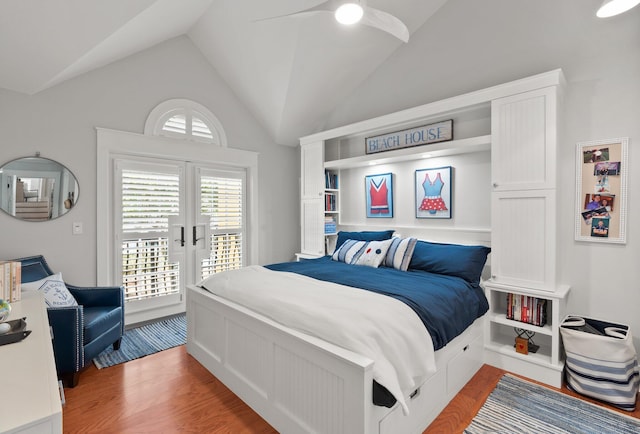 bedroom with french doors, vaulted ceiling, access to outside, ceiling fan, and hardwood / wood-style floors