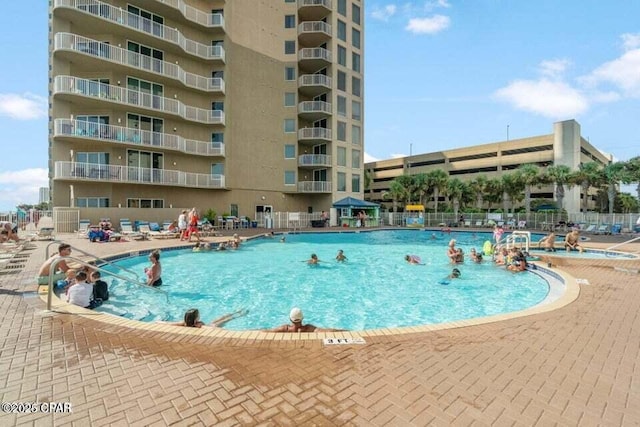 view of pool featuring a patio