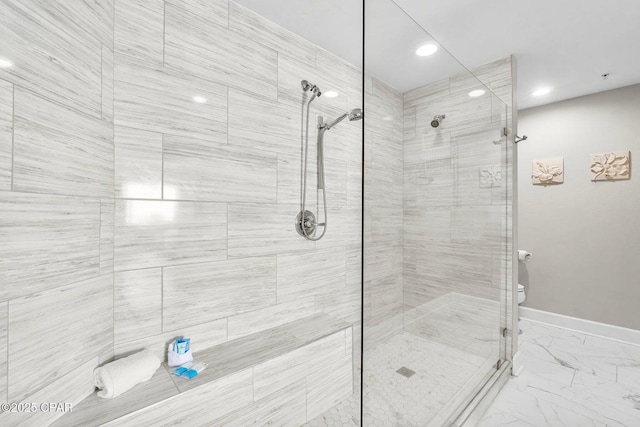 bathroom with tiled shower