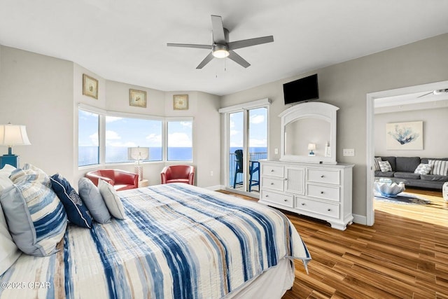 bedroom featuring hardwood / wood-style floors, access to outside, and ceiling fan