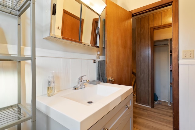 bathroom with vanity and hardwood / wood-style flooring