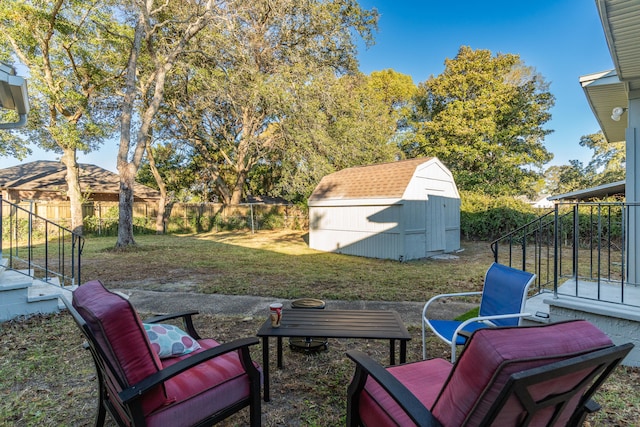 view of patio / terrace featuring a storage unit