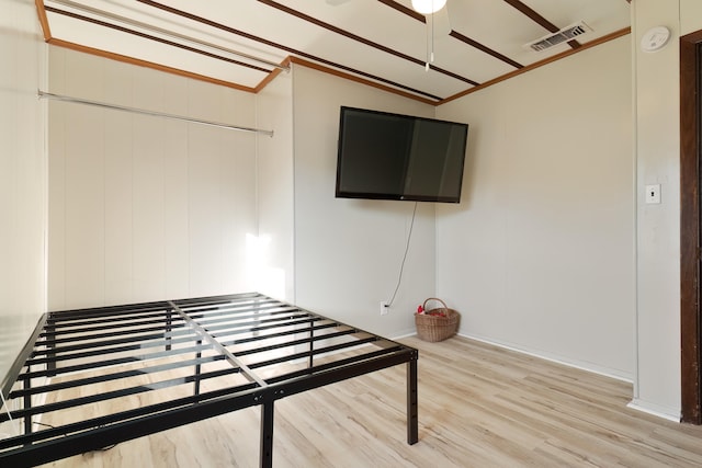 interior space featuring hardwood / wood-style flooring, lofted ceiling, and a closet