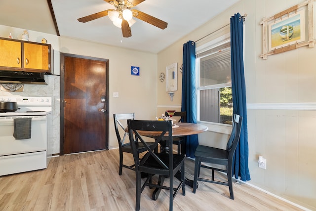 dining room with ceiling fan and light wood-type flooring