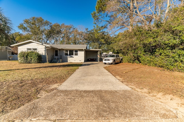 single story home featuring a front yard and a carport