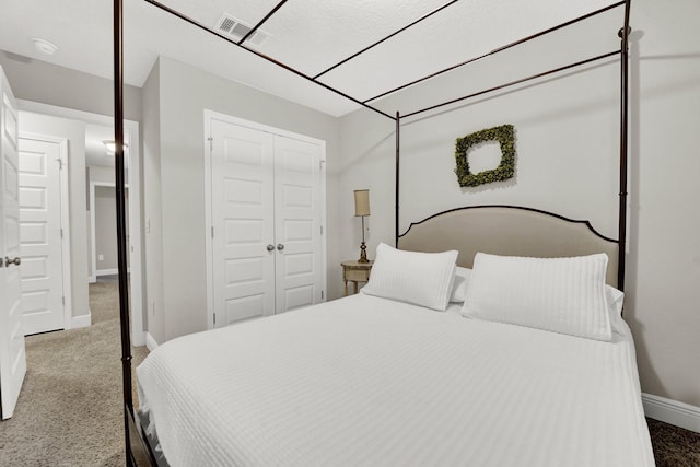 bedroom with carpet floors and a closet