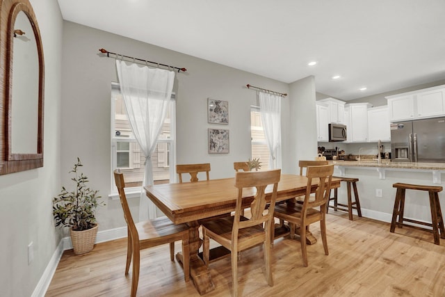 dining space featuring light hardwood / wood-style flooring