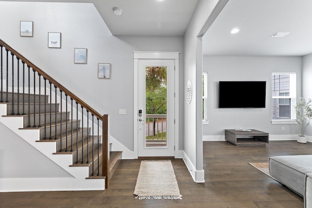 foyer with dark hardwood / wood-style floors