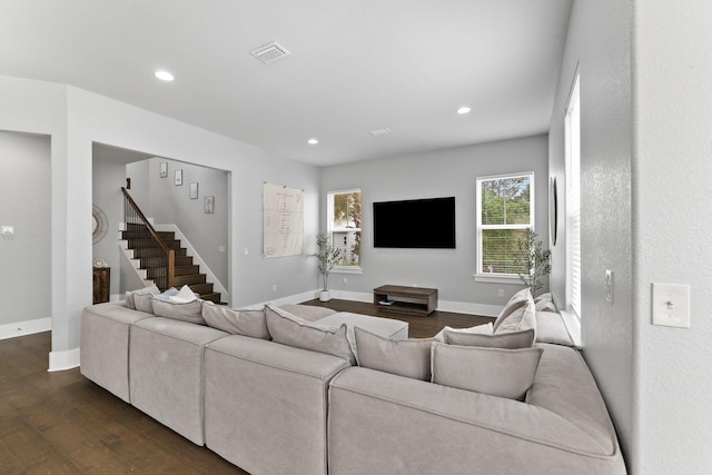 living room featuring dark hardwood / wood-style flooring