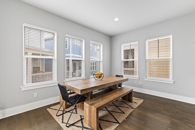 dining area featuring dark hardwood / wood-style floors