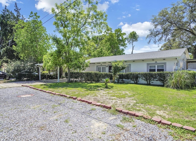 ranch-style house with a front lawn