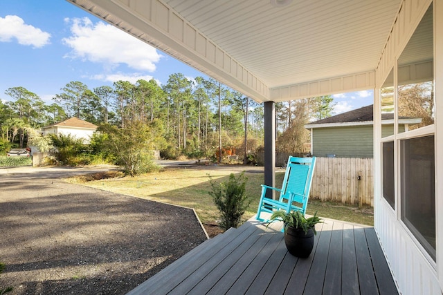 wooden terrace featuring covered porch