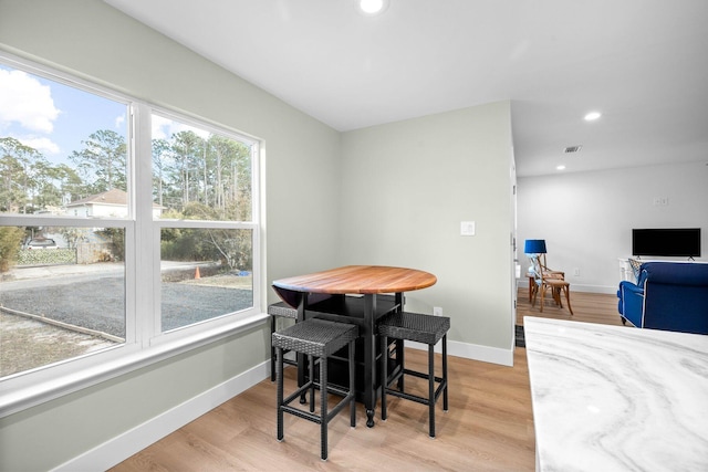 dining room with light hardwood / wood-style flooring