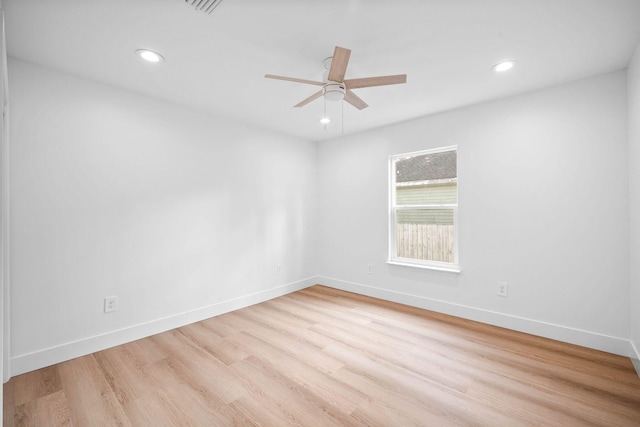 unfurnished room with ceiling fan and light wood-type flooring