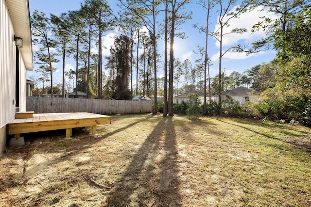 view of yard with a wooden deck