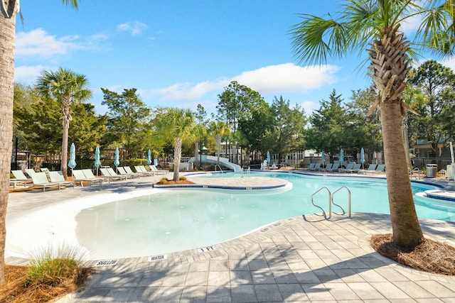 view of swimming pool featuring a patio area