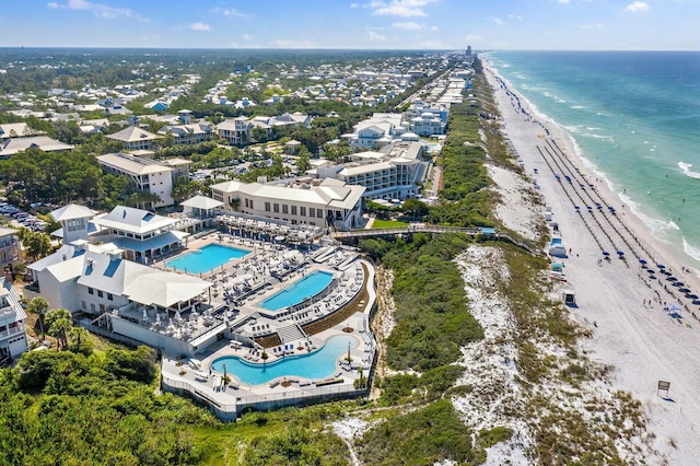 drone / aerial view with a water view and a beach view