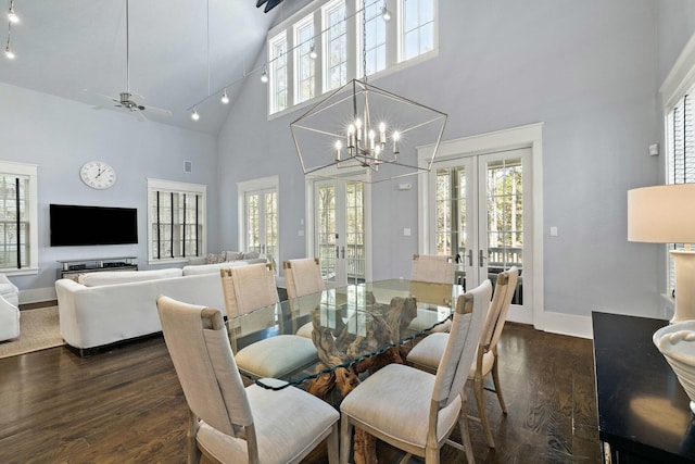 dining area featuring dark hardwood / wood-style flooring, french doors, and a healthy amount of sunlight