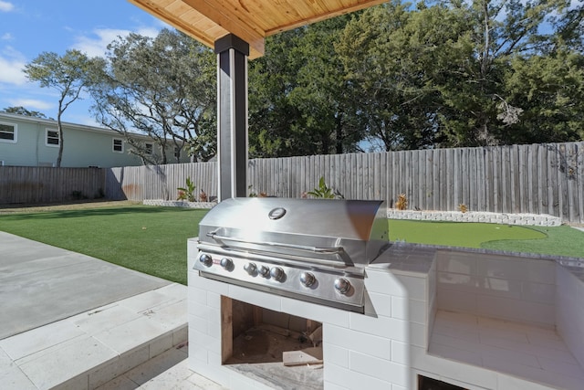 view of patio with a grill and exterior kitchen