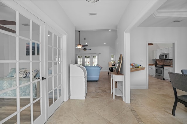 interior space featuring light tile patterned floors and french doors