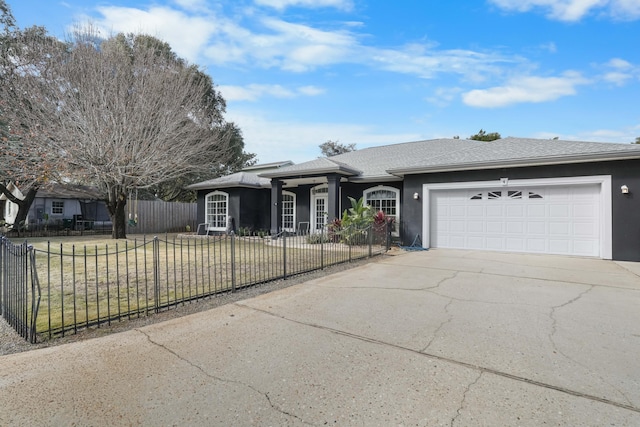 single story home featuring a garage and a front yard