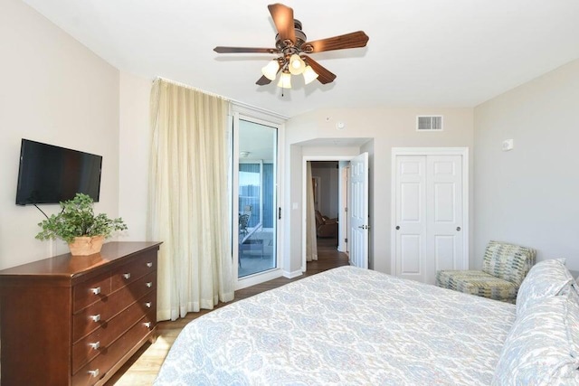 bedroom with a closet, ceiling fan, and light wood-type flooring