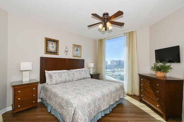 bedroom featuring dark hardwood / wood-style floors and ceiling fan