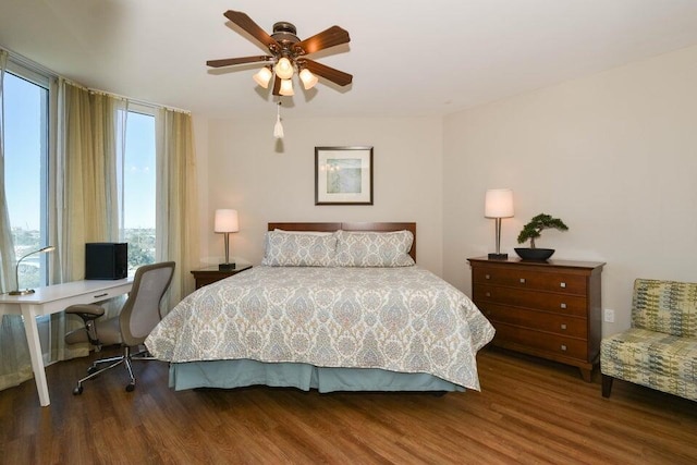 bedroom featuring dark hardwood / wood-style floors and ceiling fan