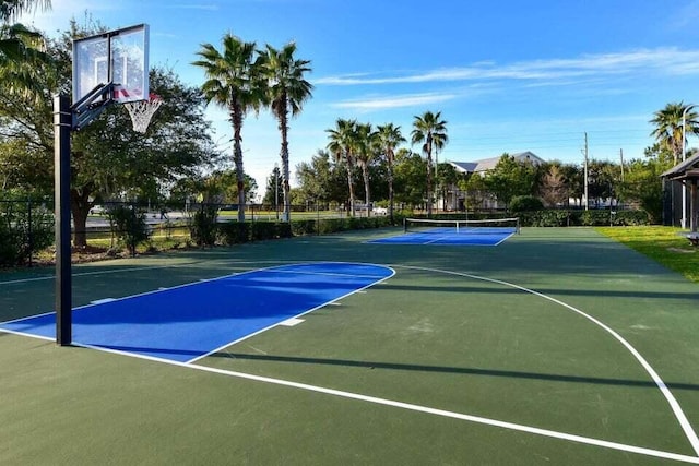 view of basketball court featuring tennis court