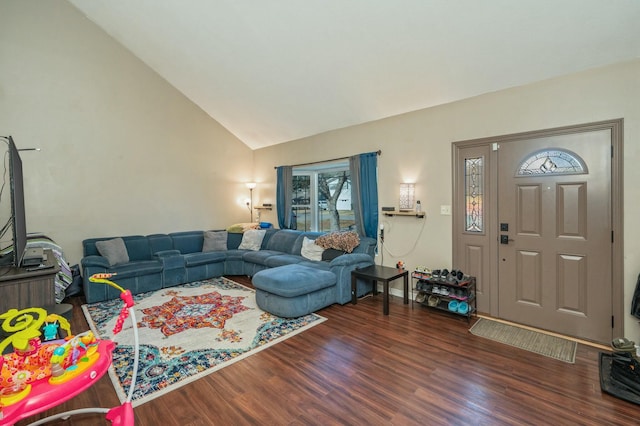 living room with dark wood-type flooring and high vaulted ceiling