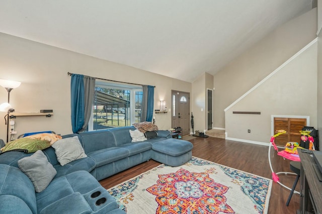 living room featuring vaulted ceiling and dark wood-type flooring