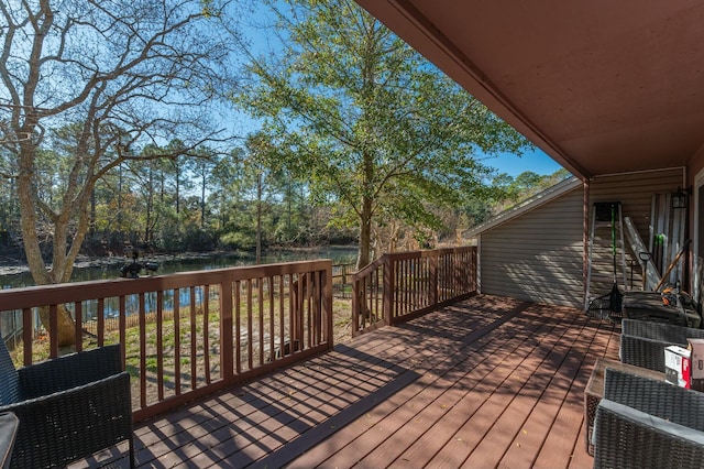 wooden deck with a water view