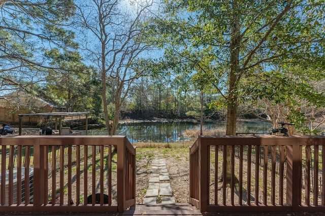 wooden deck featuring a water view