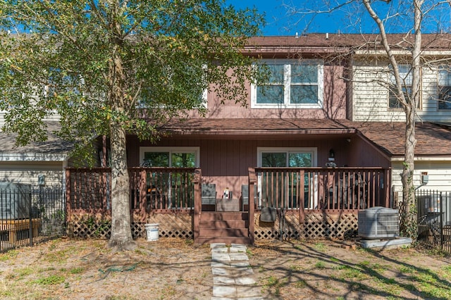 back of property featuring a deck