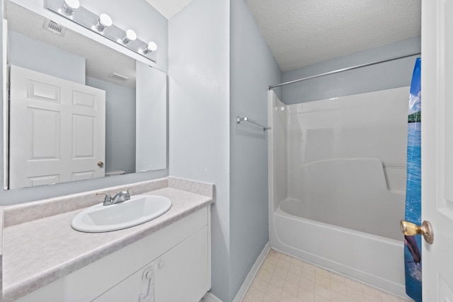 bathroom featuring vanity and a textured ceiling