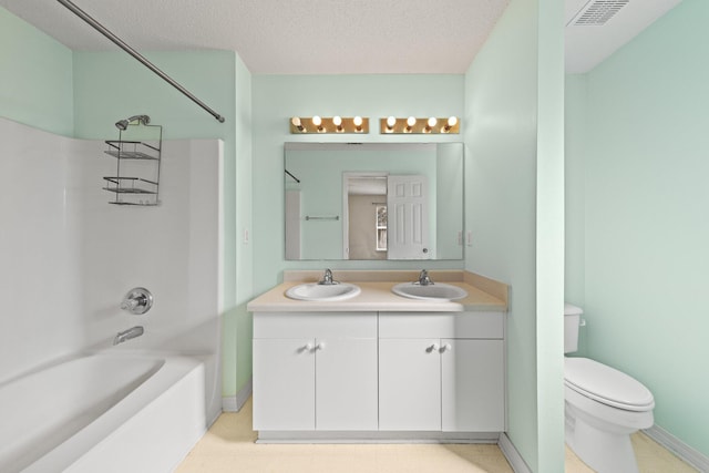 full bathroom featuring vanity, a textured ceiling,  shower combination, and toilet