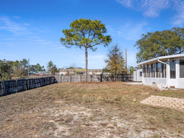 view of yard featuring a sunroom