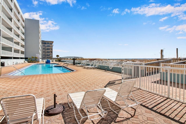 view of swimming pool featuring a patio