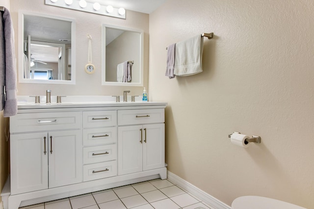 bathroom with tile patterned floors and vanity