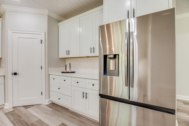 kitchen featuring stainless steel fridge with ice dispenser, crown molding, white cabinets, and light wood-type flooring