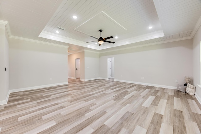 empty room with wood ceiling, light wood-type flooring, ornamental molding, a raised ceiling, and ceiling fan