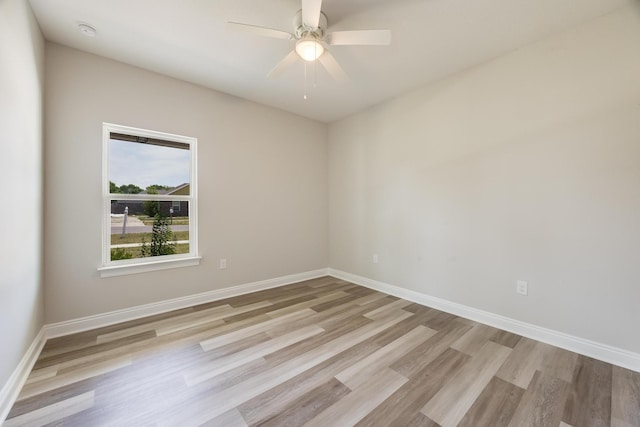 spare room featuring ceiling fan and light hardwood / wood-style floors