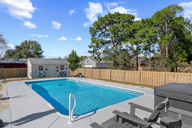 view of swimming pool with a hot tub, an outdoor structure, and a patio area