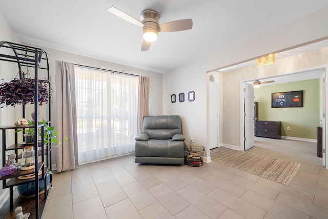 sitting room featuring ceiling fan