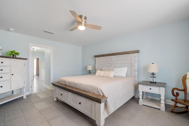 tiled bedroom with ceiling fan