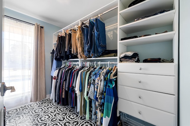 spacious closet with tile patterned flooring