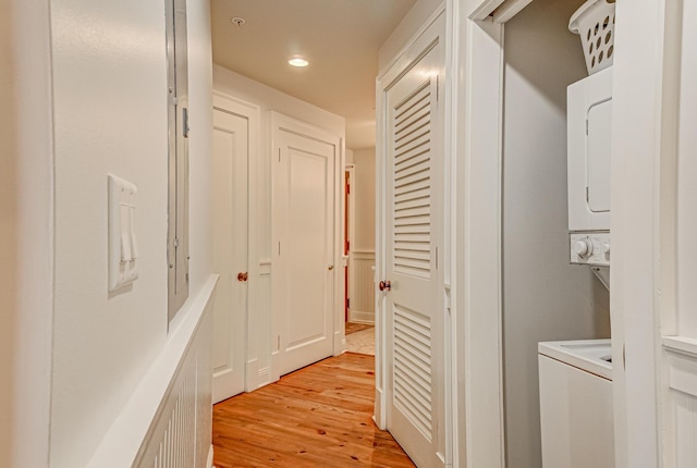 corridor with light hardwood / wood-style floors