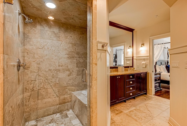 bathroom featuring walk in shower and vanity